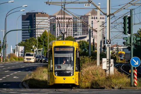 Road traffic, tram on Altendorfer Straße, in the background the town hall, left and the Weststadt