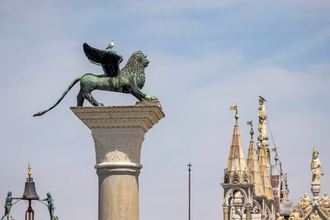 View of the city from the Canale della Giudecca, granite column on St Mark's Square with the Lion