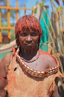 Southern Ethiopia, woman of the Hammer people in Dimeka, dress made of goatskin and hair dyed with