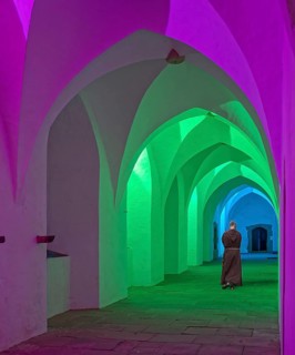 Cloister monastery colourfully illuminated with monk Möllenbeck Rinteln Germany