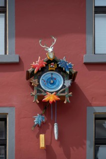 Colourful cuckoo clock on a house, Villingen-Schwenningen, Baden-Württemberg, Germany, Europe