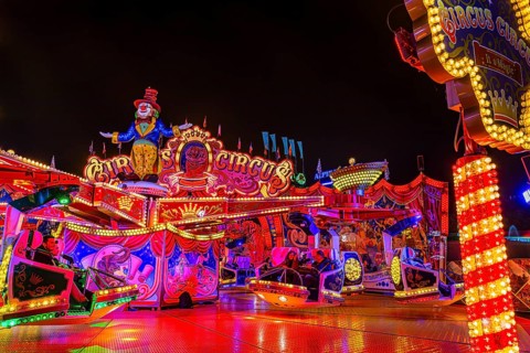 Illuminated round and elevated ride Circus Circus at standstill, night shot, Oktoberfest,