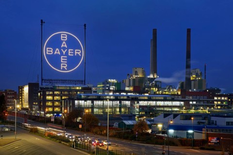 Bayer cross in the blue hour on the premises of Bayer AG, Leverkusen, Bergisches Land, North