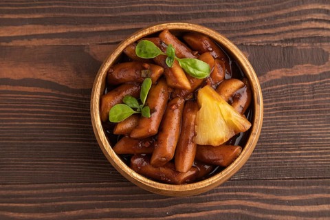 Tteokbokki or Topokki, fried rice cake stick, popular Korean street food with spicy jjajang sauce