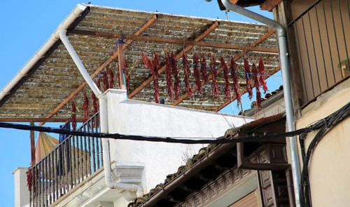 Red paprika peppers drying on house roof terrace, Cuacos de Yuste, La Vera, Extremadura, Spain,