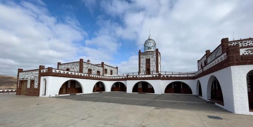 Panorama of view of inner courtyard of building complex of lighthouse Faro de la Entallada from 50s