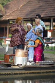 Tealady, 83 years old, making Indian tea on her boat, Backwaters, Kumarakom, Kerala, India, Asia