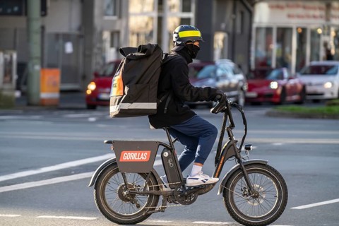 Bicycle courier from the fast delivery service Gorillas, delivers groceries, currently in over 20