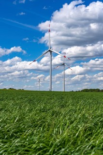 Wind farm, wind turbine, wind turbines from the manufacturer Enercon, blue sky with many white
