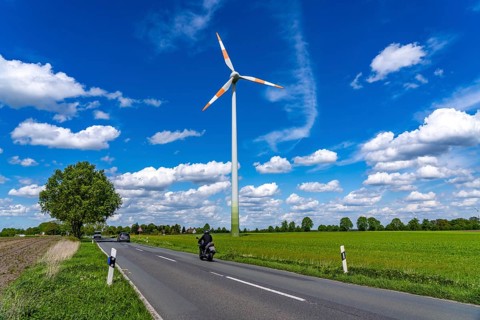 Wind turbine, wind energy plant from the manufacturer Enercon, blue sky with many white clouds,