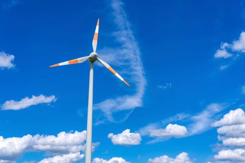 Wind turbine, wind energy plant from the manufacturer Enercon, blue sky with many white clouds,