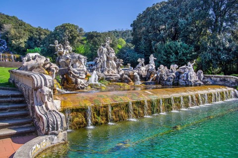 Fountain sculptures at the water basins in the garden of the royal palace Palazzo Reale, Italian