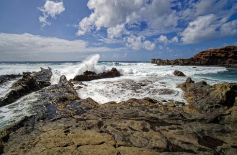 Lava rocks at the Playa de los Ciclos near the Green Lake, Lago Verde, El Golfo, Lanzarote, Canary