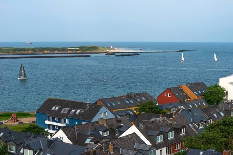 View from the upper land over houses in the lower land to the Helgoland dune, offshore island