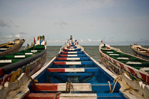 Colourful front of pirogues used by fishermen (Joal, Senegal)