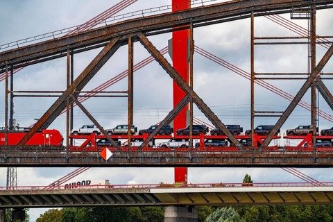 The Beeckerwerther Rhine bridge of the A42 motorway, truck traffic, in front of it the Haus-Knipp