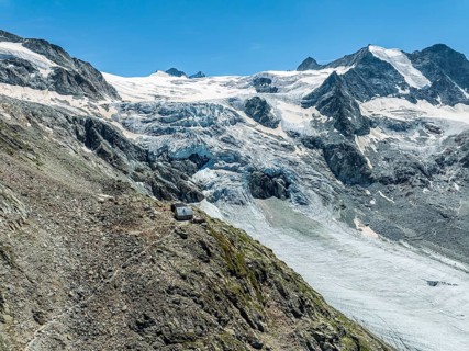 Mountain hut Cabane de Moiry, located close to the retreating Moiry glacier, hiking trail, aerial