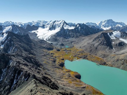 Mountain panorama, aerial view, 4000 metre peak with glacier, mountain pass and mountain lake