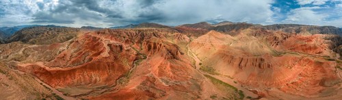 Panorama, Eroded mountain landscape, Canyon with red and orange rock formations, Aerial view,