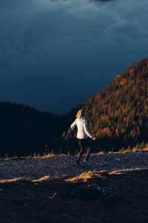 Trail running in autumn on the Jochberg on Lake Walchensee against the wonderful backdrop of the