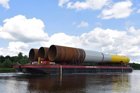 Tugboat pulling parts of an offshore wind turbine through the Kiel Canal, Kielkanal,