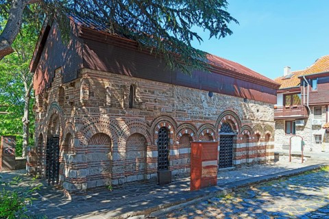 Old Byzantine church with red roof and brickwork on a sunny day, Church of St Paraskeva, Black Sea,
