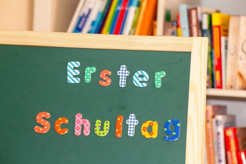 Blackboard with the inscription First day at school