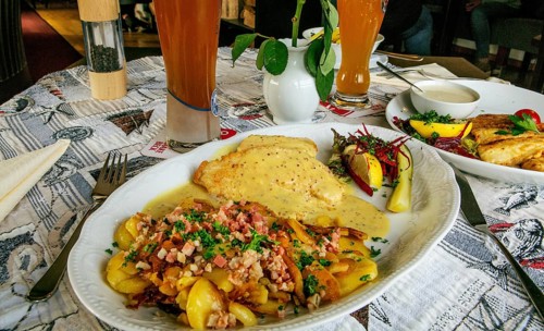 Wremer Panfisch with mustard sauce and bacon fried potatoes in the fish restaurant Wremer