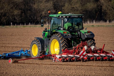 Sugar beet being sown in spring, precision sowing with precision seed drill, behind a tractor,