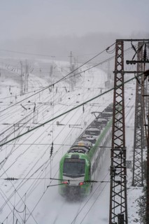 Onset of winter with lots of fresh snow and temperatures below -5 degrees during the day, railway