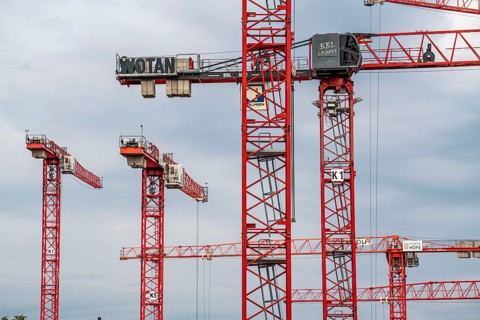 Construction cranes, on a large building site in Düsseldorf, Deiker Höfe, North Rhine-Westphalia,