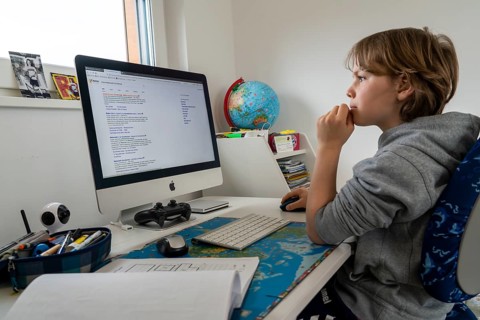 Young, primary school pupils, home learning, doing schoolwork, distance learning, virtual