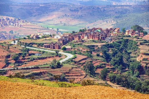 Terraced fields and two stories brick houses in Betsileo rural village in the Ambositra District,