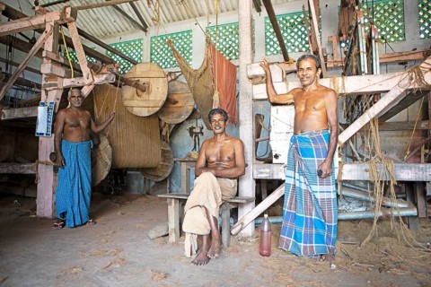 Indian worker in the weaving mill of the Labourers Coir Mats and Mattings Cooperation, coir mat