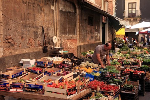 Fruit, vegetables, cheese and meat at the historic market in Catania, Sicily, Italy, Europe