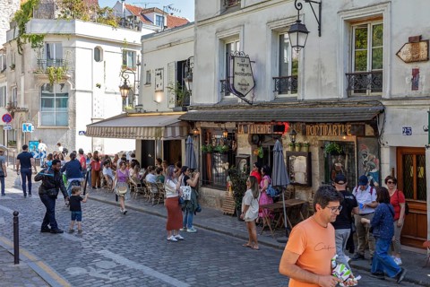 A lively café area in Montmartre, Paris with lots of people, Paris