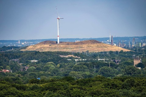 View of the Mottbruch spoil tip in Gladbeck, with wind turbine, from the Haniel spoil tip, lNorth