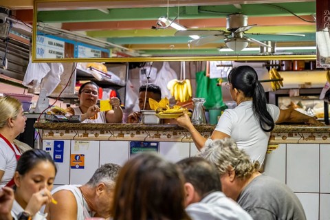 Waitress at a food stall, Mercado Central de San José, San José, Costa Rica, Central America