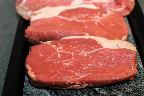 Raw roast beef on a platter