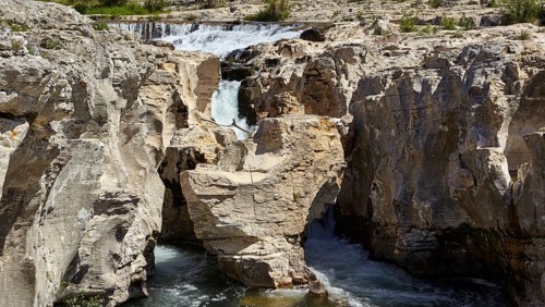 The cascades of Sautadet with limestone cliffs and the river Cèze in La Roque-sur-Cèze, Département