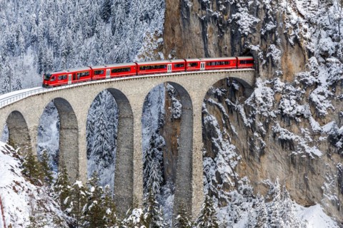 Rhaetian Railway train at the famous Landwasser Viaduct on the Albula railway Stadler Rail
