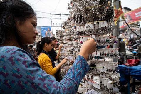 Women buys jewelleries at street market ahead of Durga Puja festival on October 7, 2024 in
