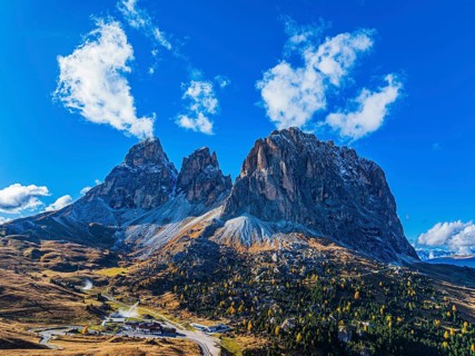 The peaks of the Sassolungo Group, Passo Sella, drone shot, Val Gardena, Dolomites, Autonomous