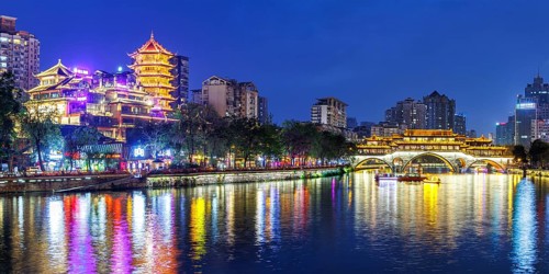 Chengdu Anshun Bridge over Jin River with pagoda at night panorama in Chengdu, China, Asia