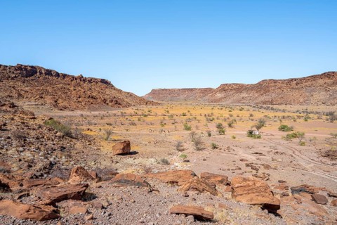 Barren landscape with boulders in a valley, desert landscape, Twyfelfontein, Kunene, Namibia,