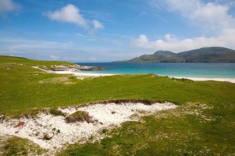 Machair grassland and sandy beach at Bagh a Deas, South Bay, Vatersay island, Barra, Outer