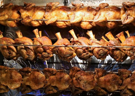 Grilled knuckle of pork and chicken on the spit