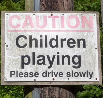 Caution children playing road sign, England, UK
