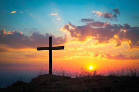 Easter concept cross on Golgotha Calvary hill against a dramatic sunset, AI generated