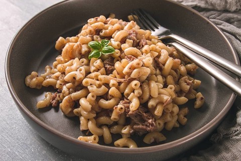 Pasta with stewed meat, pasta in the navy, horns, homemade, no people